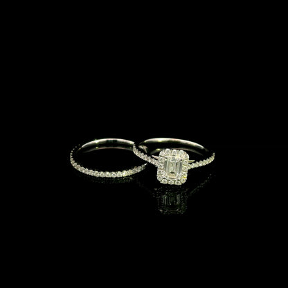 Emerald cut diamond halo bridal set in 18K white gold with a diamond engagement ring and matching wedding band.