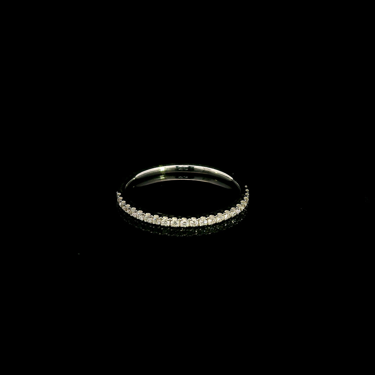 Emerald cut diamond halo bridal set in 18K white gold with a diamond engagement ring and matching wedding band.