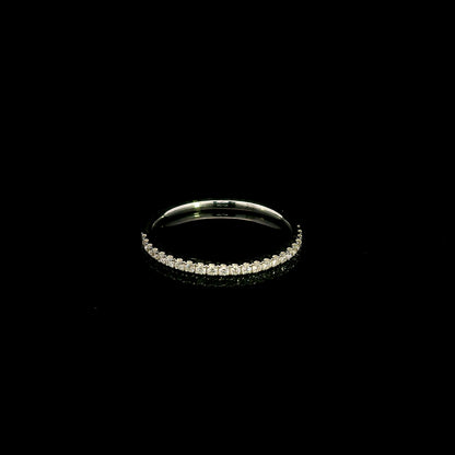 Emerald cut diamond halo bridal set in 18K white gold with a diamond engagement ring and matching wedding band.