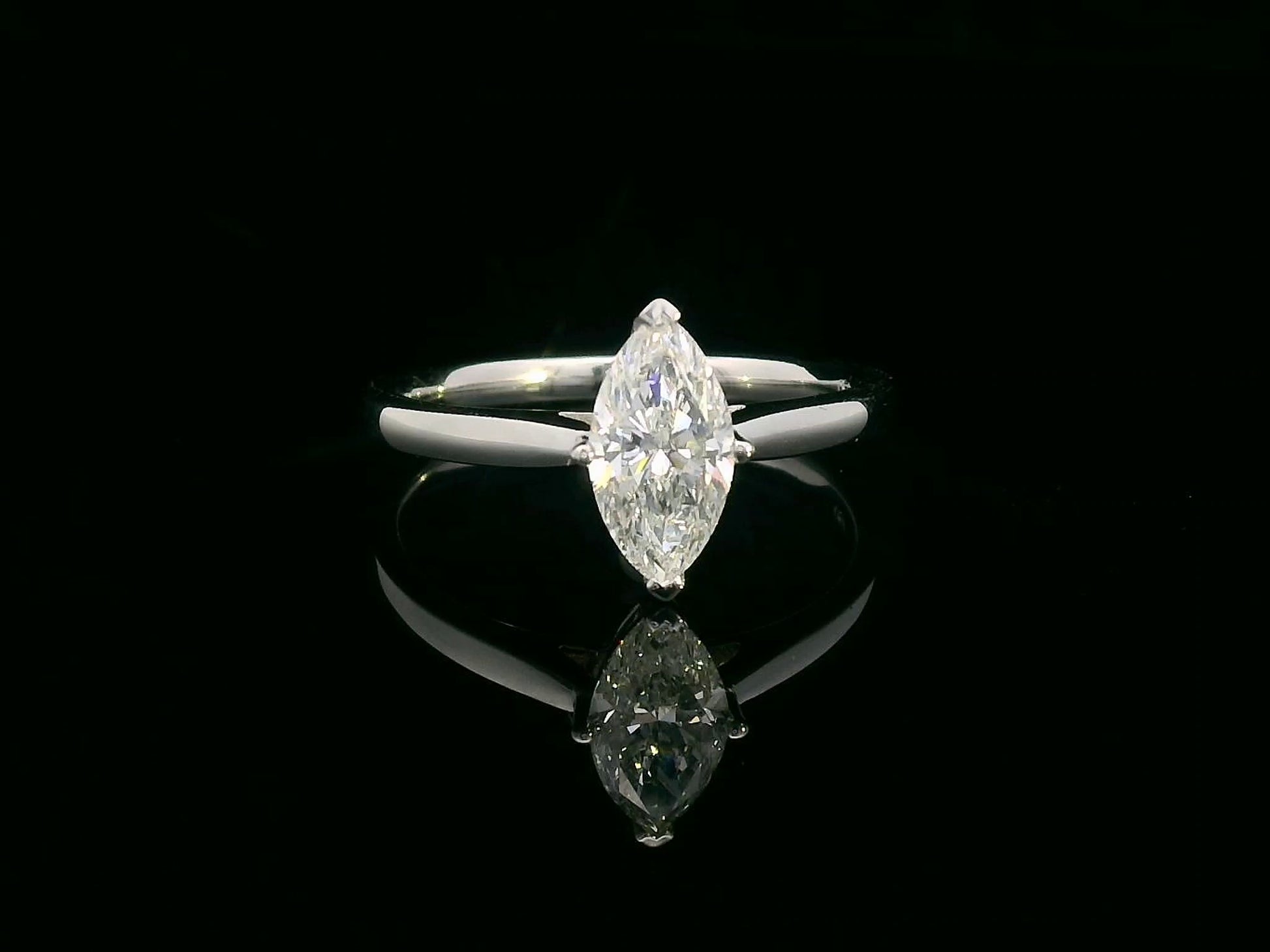 18K white gold solitaire engagement ring with 1.01 carat marquise diamond, D color, IGI certified