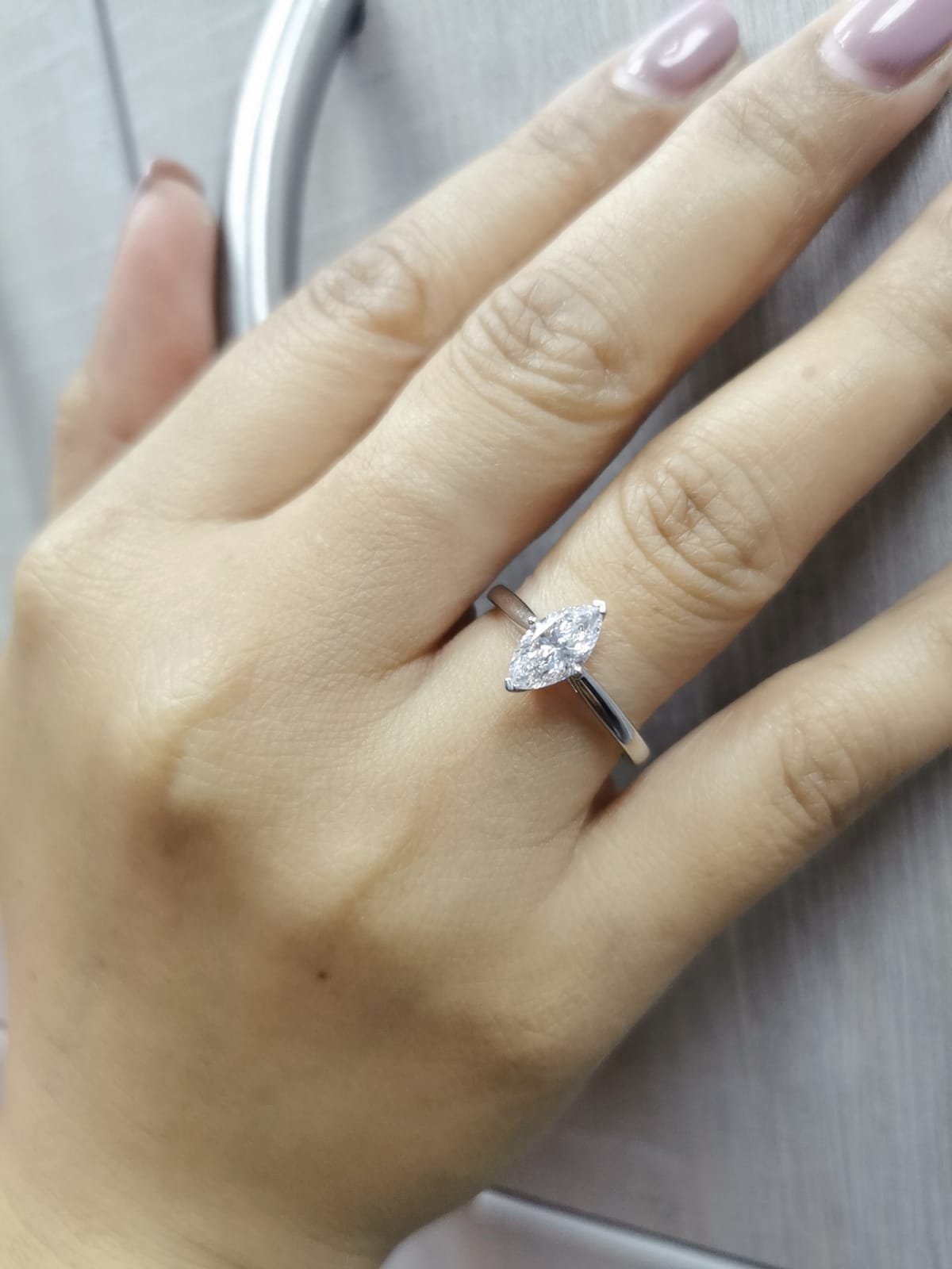 18K white gold solitaire engagement ring with 1.01 carat marquise diamond, D color, IGI certified