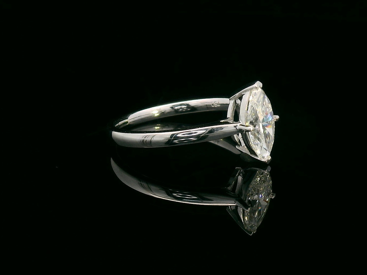 18K white gold solitaire engagement ring with 1.01 carat marquise diamond, D color, IGI certified