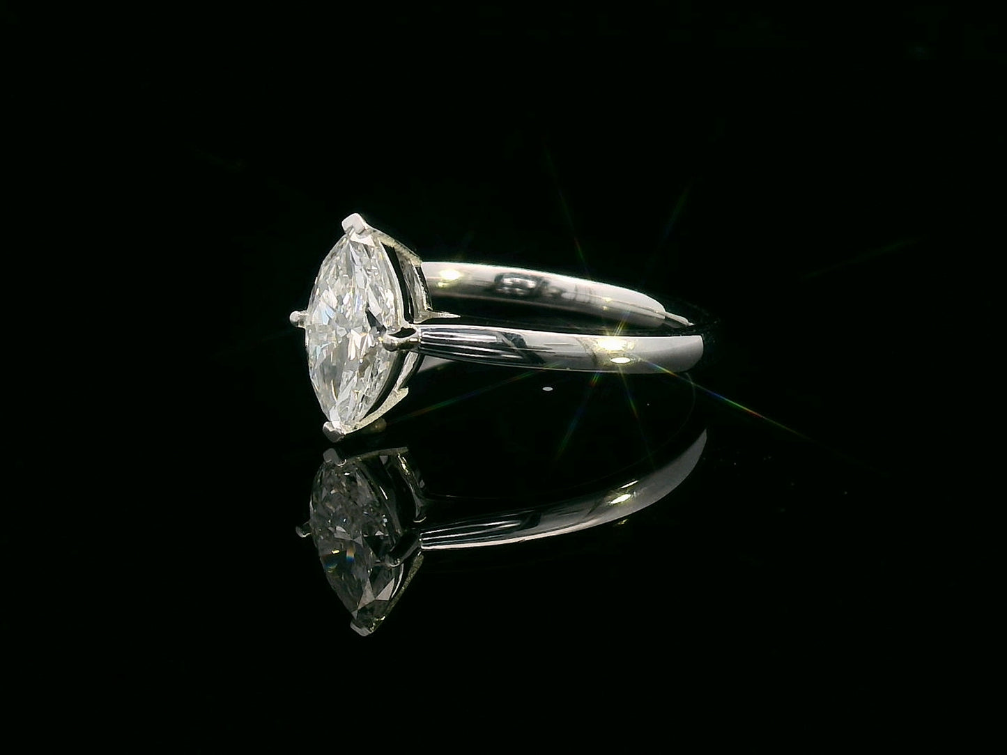 18K white gold solitaire engagement ring with 1.01 carat marquise diamond, D color, IGI certified