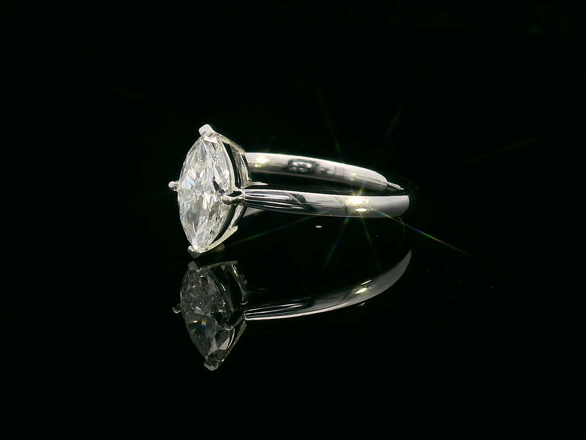 18K white gold solitaire engagement ring with 1.01 carat marquise diamond, D color, IGI certified
