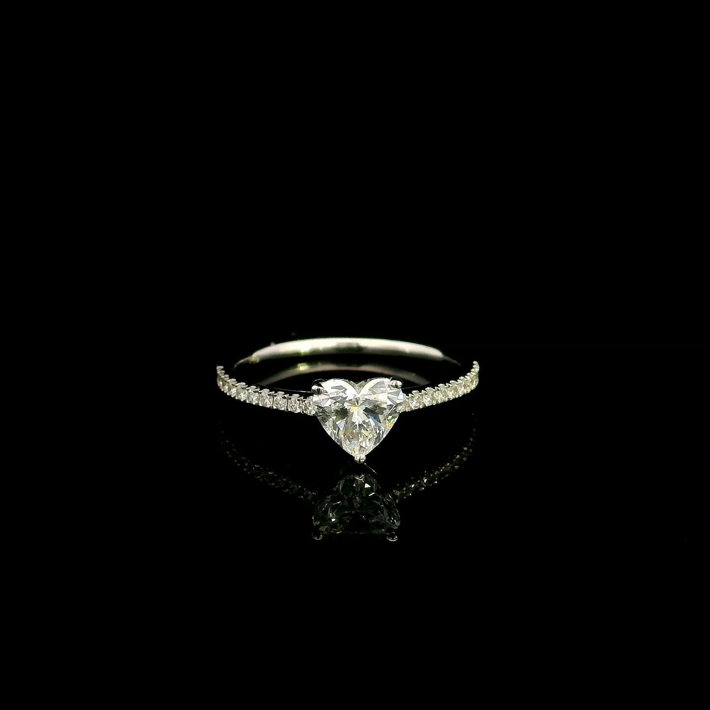 18K white gold heart shaped diamond engagement ring featuring a 0.90 carat IGI certified natural heart diamond with a pavé diamond band.