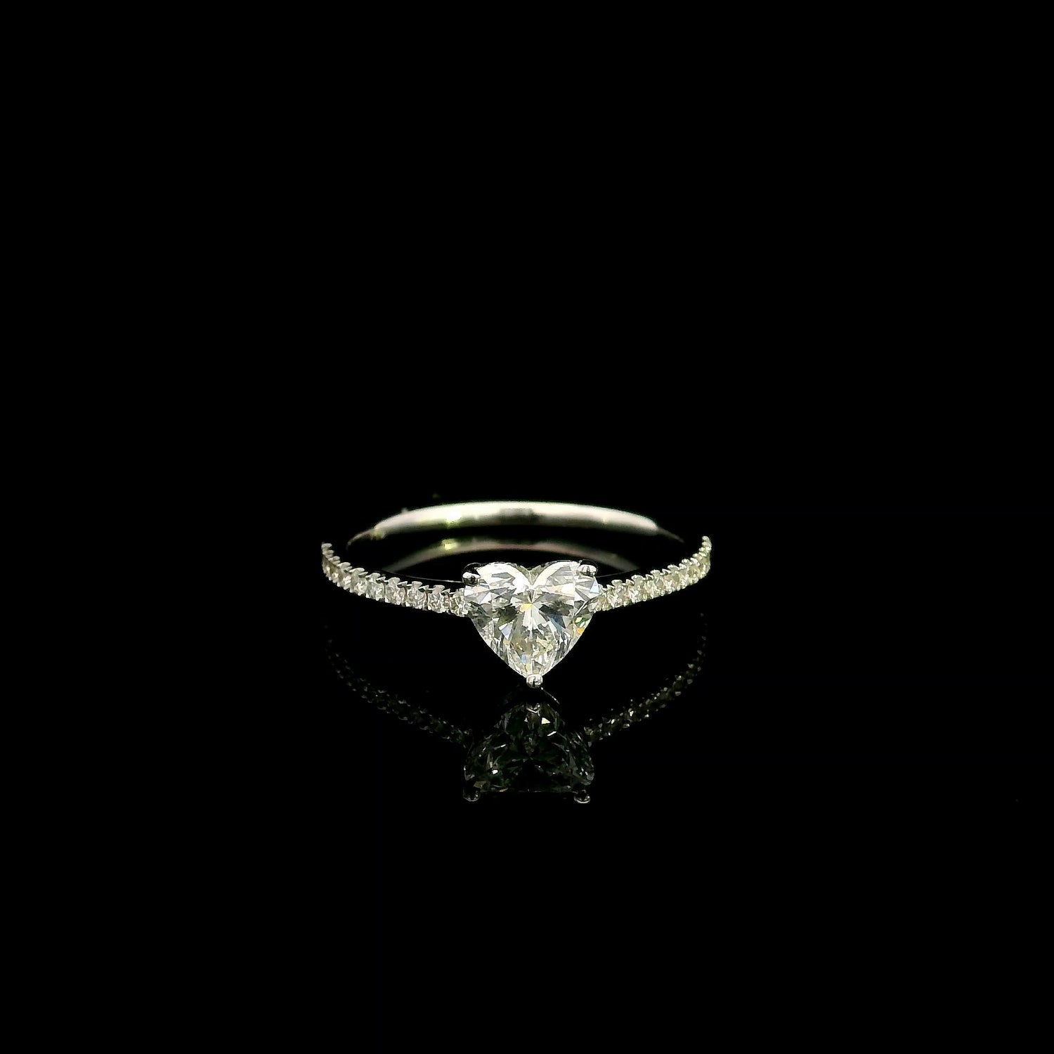 18K white gold heart shaped diamond engagement ring featuring a 0.90 carat IGI certified natural heart diamond with a pavé diamond band.