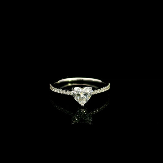 18K white gold heart shaped diamond engagement ring featuring a 0.90 carat IGI certified natural heart diamond with a pavé diamond band.