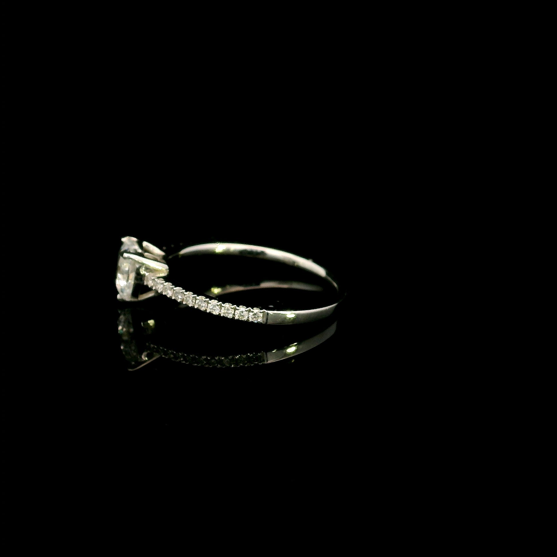 18K white gold heart shaped diamond engagement ring featuring a 0.90 carat IGI certified natural heart diamond with a pavé diamond band.