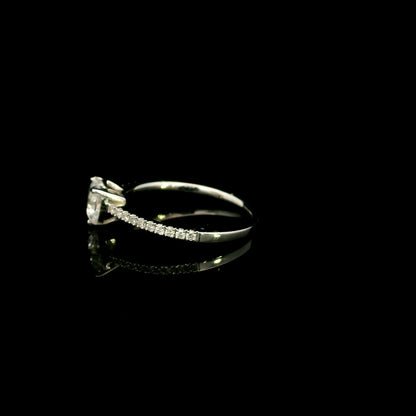 18K white gold heart shaped diamond engagement ring featuring a 0.90 carat IGI certified natural heart diamond with a pavé diamond band.