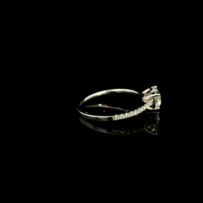 18K white gold heart shaped diamond engagement ring featuring a 0.90 carat IGI certified natural heart diamond with a pavé diamond band.