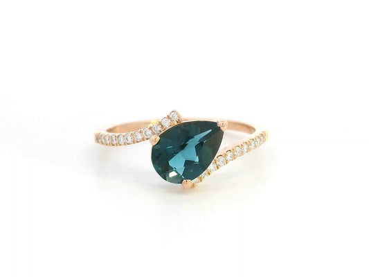 18K rose gold ring with pear-shaped London Blue Topaz and pavé diamond band