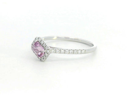 Silver ring with a pink gemstone on a white background