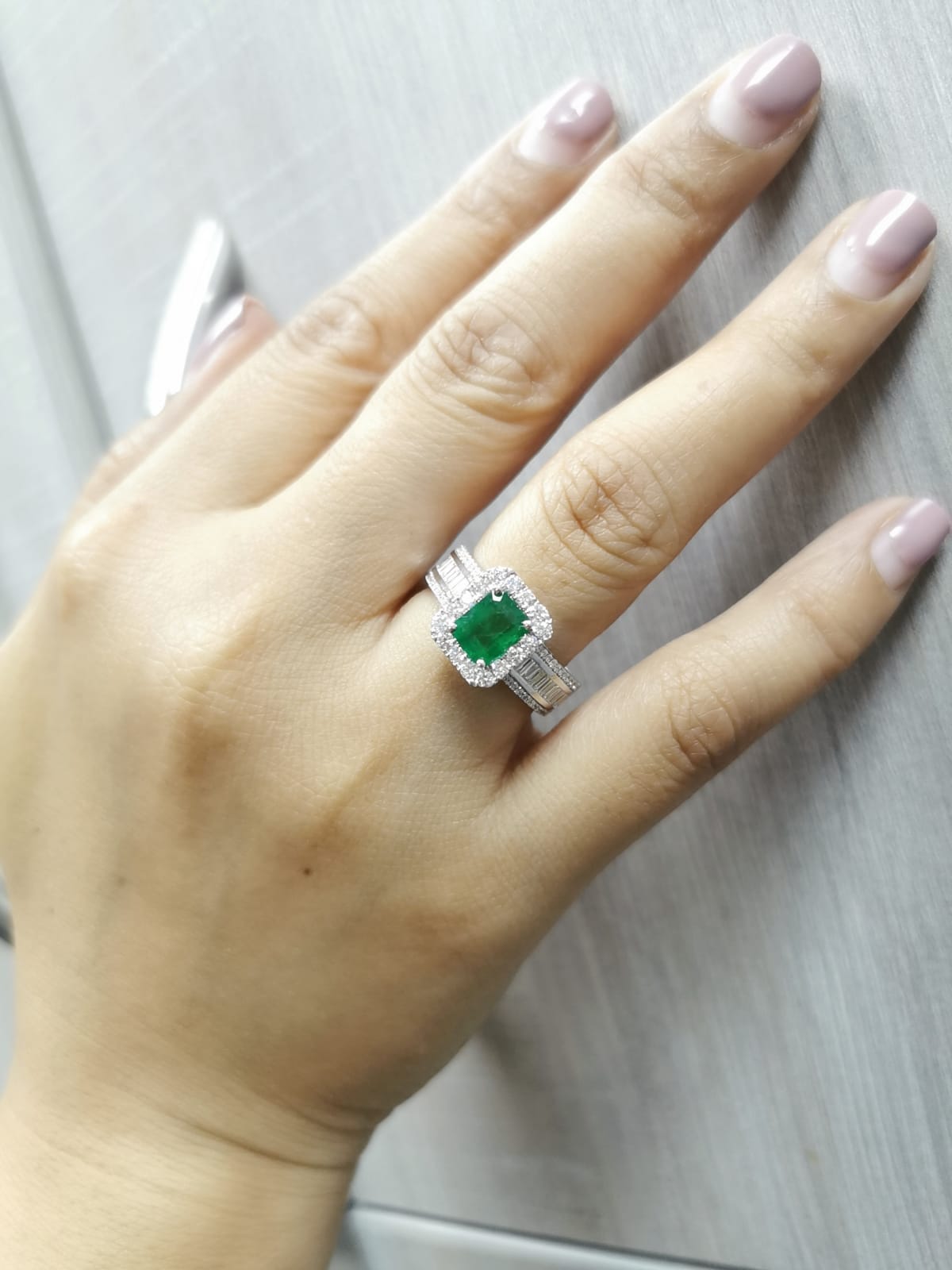 18K White Gold Emerald-Cut Emerald and Diamond Halo Ring with Baguette Accents