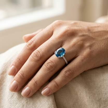 Swiss blue topaz diamond ring in 18K white gold oval cut
