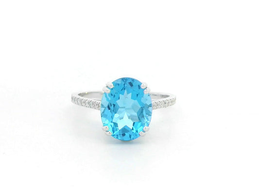 18K white gold ring with 4.58 carat oval Swiss Blue Topaz and diamond-accented band