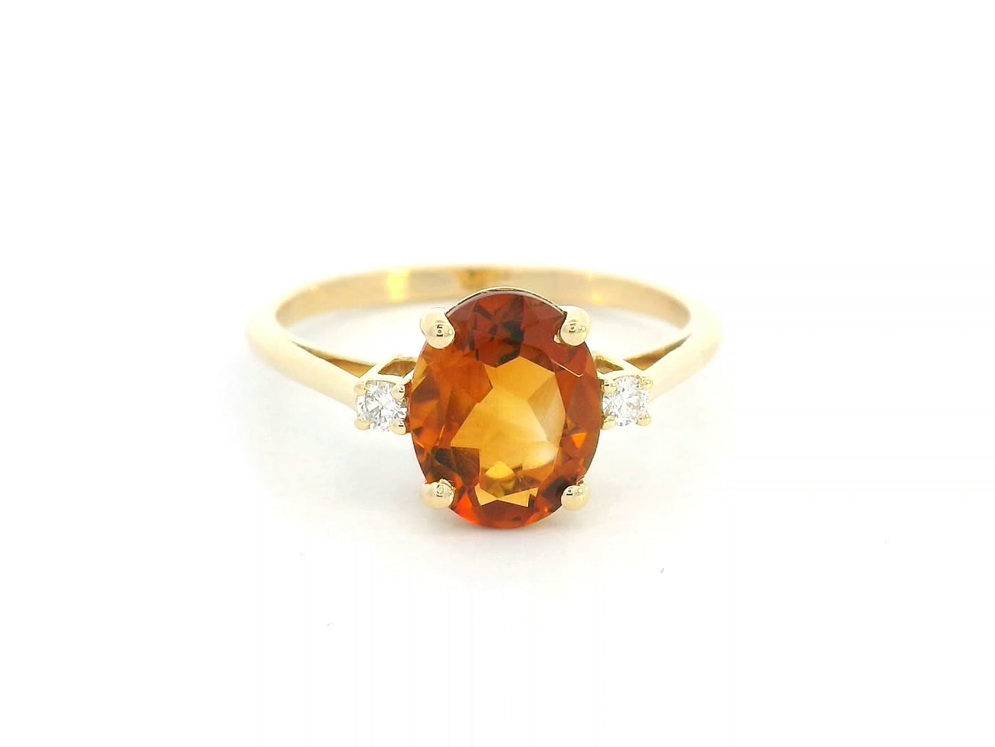Oval citrine ring with diamond accents in 18K yellow gold


