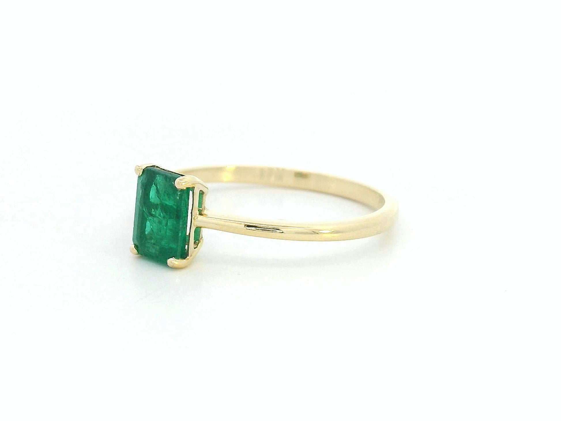 Emerald-cut emerald engagement ring in 18K gold