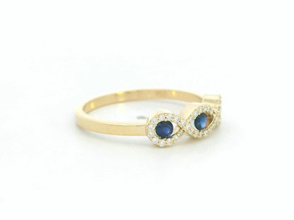 Elegant infinity motif gold ring with sapphires and diamonds 