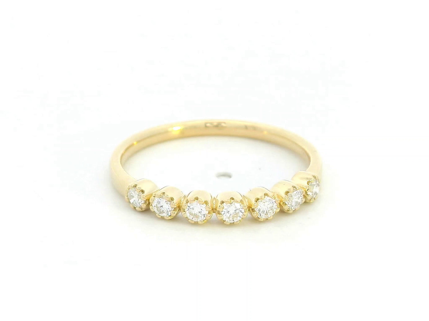 18K yellow gold half eternity ring with seven round diamonds

