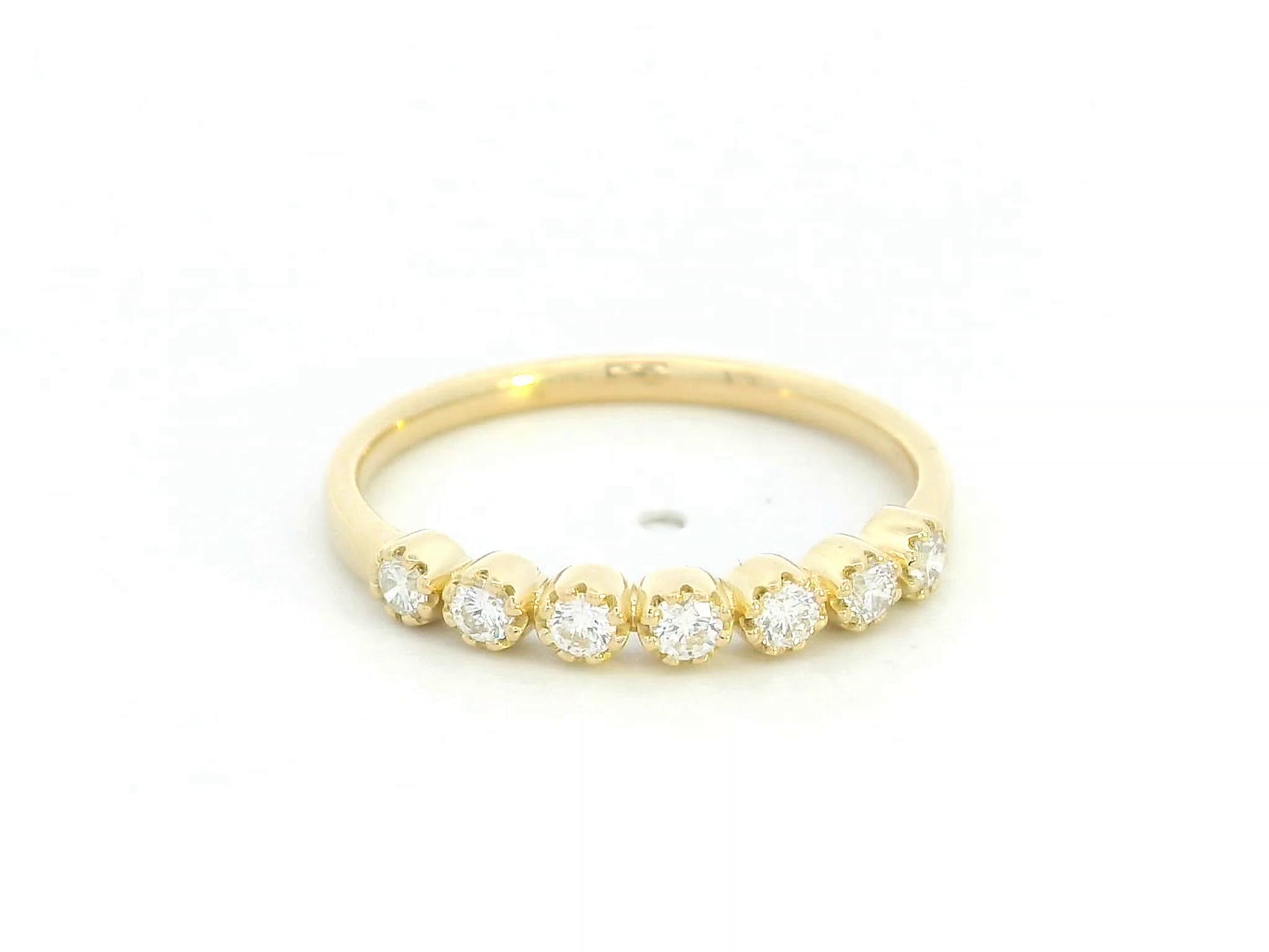 18K yellow gold half eternity ring with seven round diamonds

