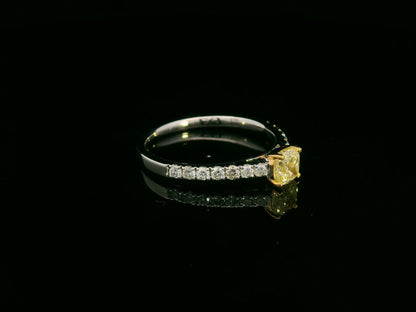 0.57 carat yellow diamond engagement ring with pave diamond band