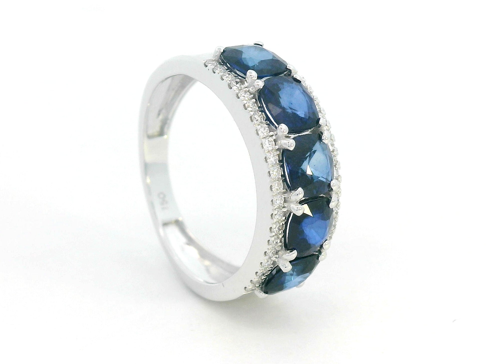 Five-Stone Sapphire Ring Framed by Diamonds in White Gold