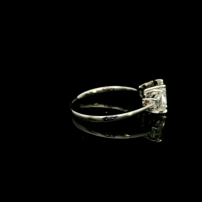 18K white gold radiant cut diamond engagement ring with a 1.51 carat HRD certified centre diamond and trapezoid side diamonds.