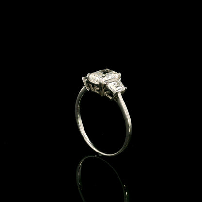 18K white gold radiant cut diamond engagement ring with a 1.51 carat HRD certified centre diamond and trapezoid side diamonds.