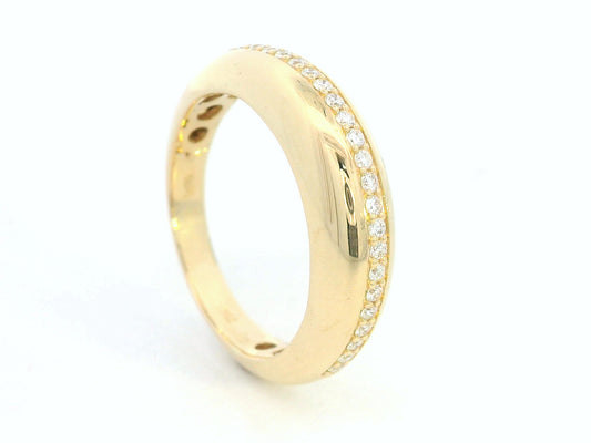 Gold ring with small diamonds on a white background