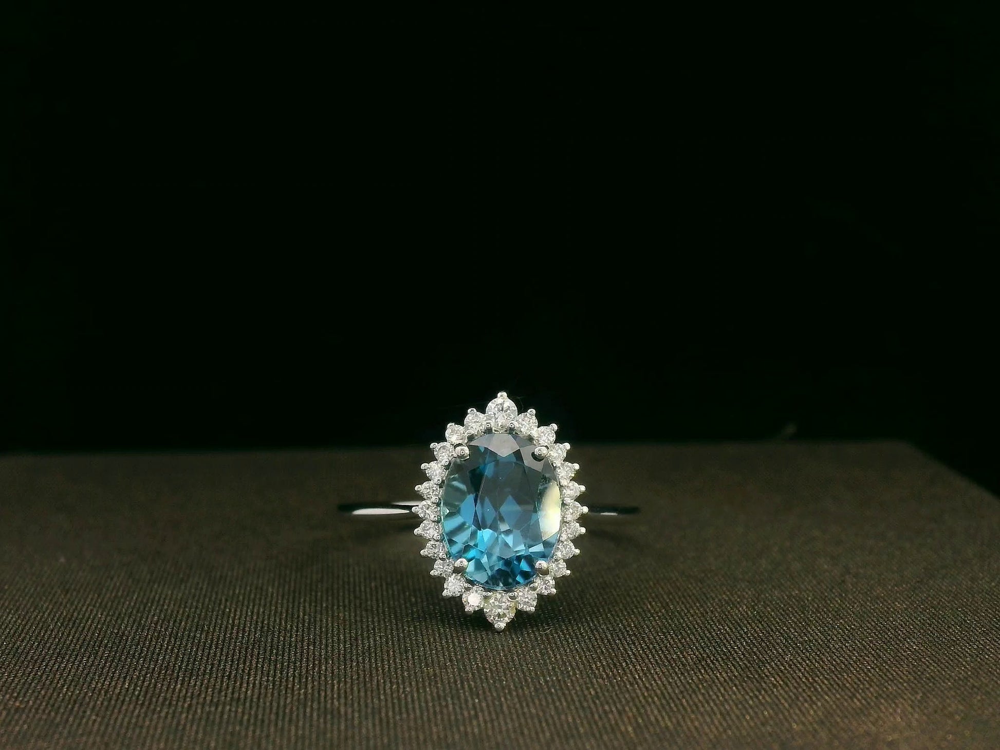 18k white gold London Blue Topaz and diamond halo ring