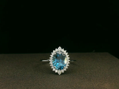 18k white gold London Blue Topaz and diamond halo ring