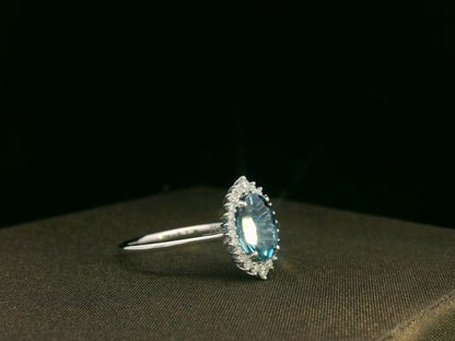 18k white gold London Blue Topaz and diamond halo ring