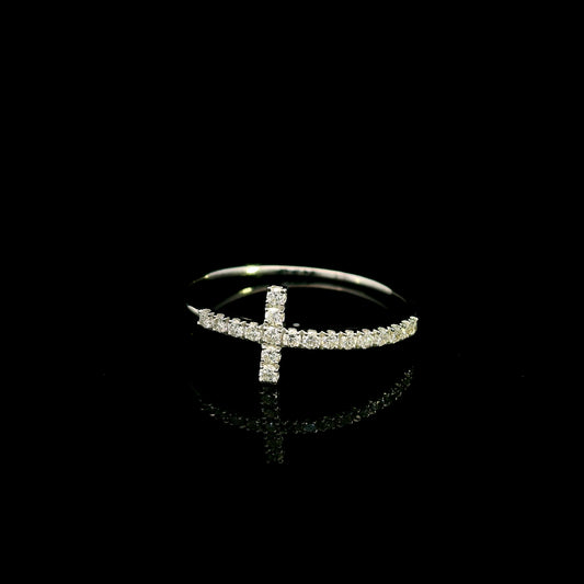 Diamond cross ring in 18K white gold featuring round brilliant diamonds set across the cross and along the slender band.
