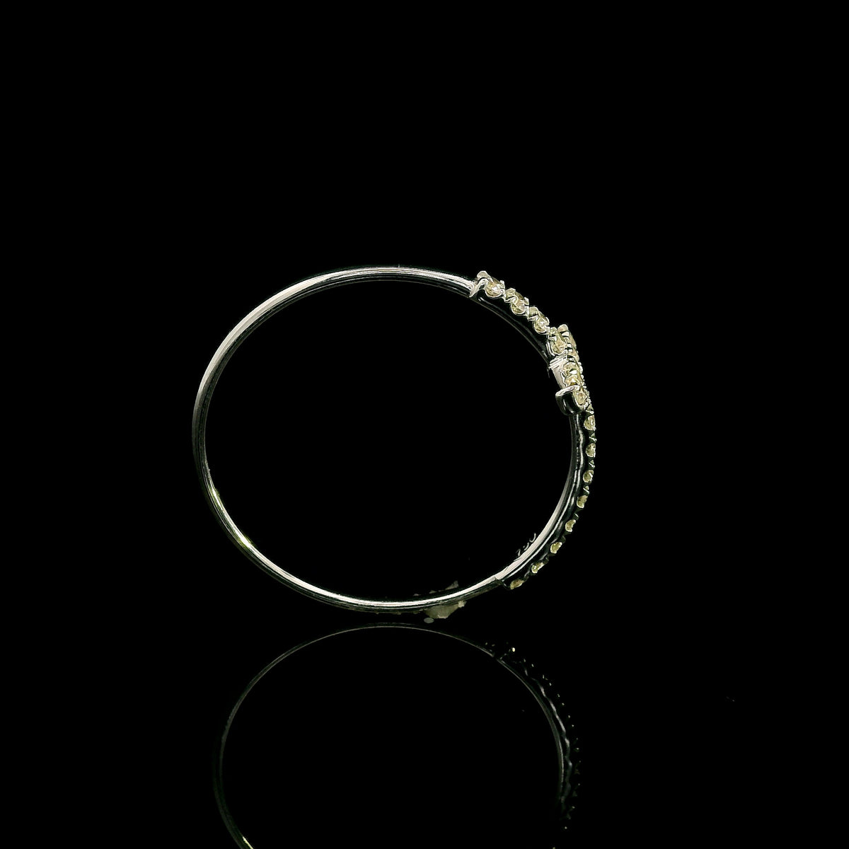 Diamond cross ring in 18K white gold featuring round brilliant diamonds set across the cross and along the slender band.