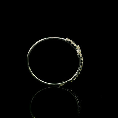 Diamond cross ring in 18K white gold featuring round brilliant diamonds set across the cross and along the slender band.