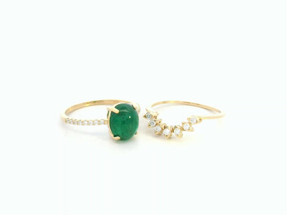 Side view highlighting emerald centerpiece and diamond detailing
