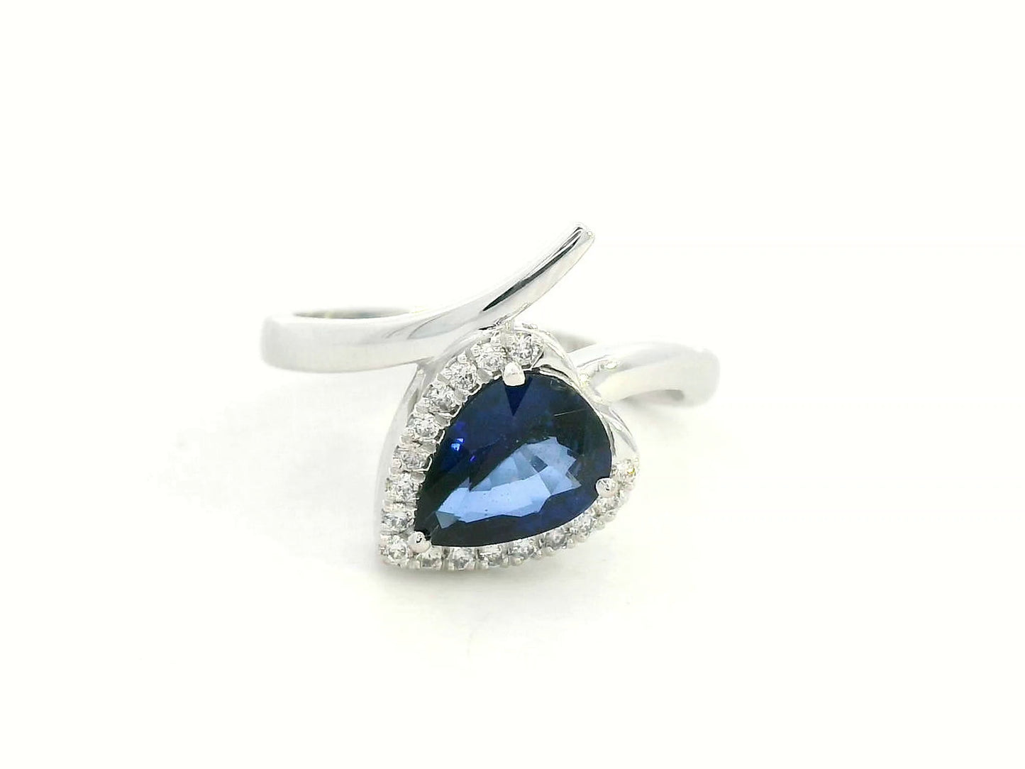 Front view of 18k white gold ring with 1.51 ct pear-shaped blue sapphire and 0.13 ct diamonds,
