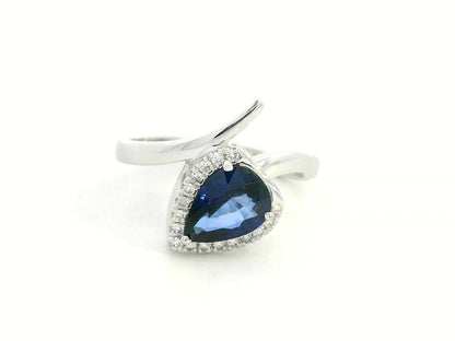 Front view of 18k white gold ring with 1.51 ct pear-shaped blue sapphire and 0.13 ct diamonds,