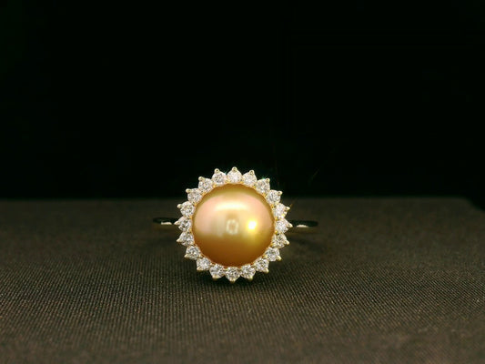 Front view of 18k yellow gold ring with golden South Sea pearl and 0.28 ct diamond halo