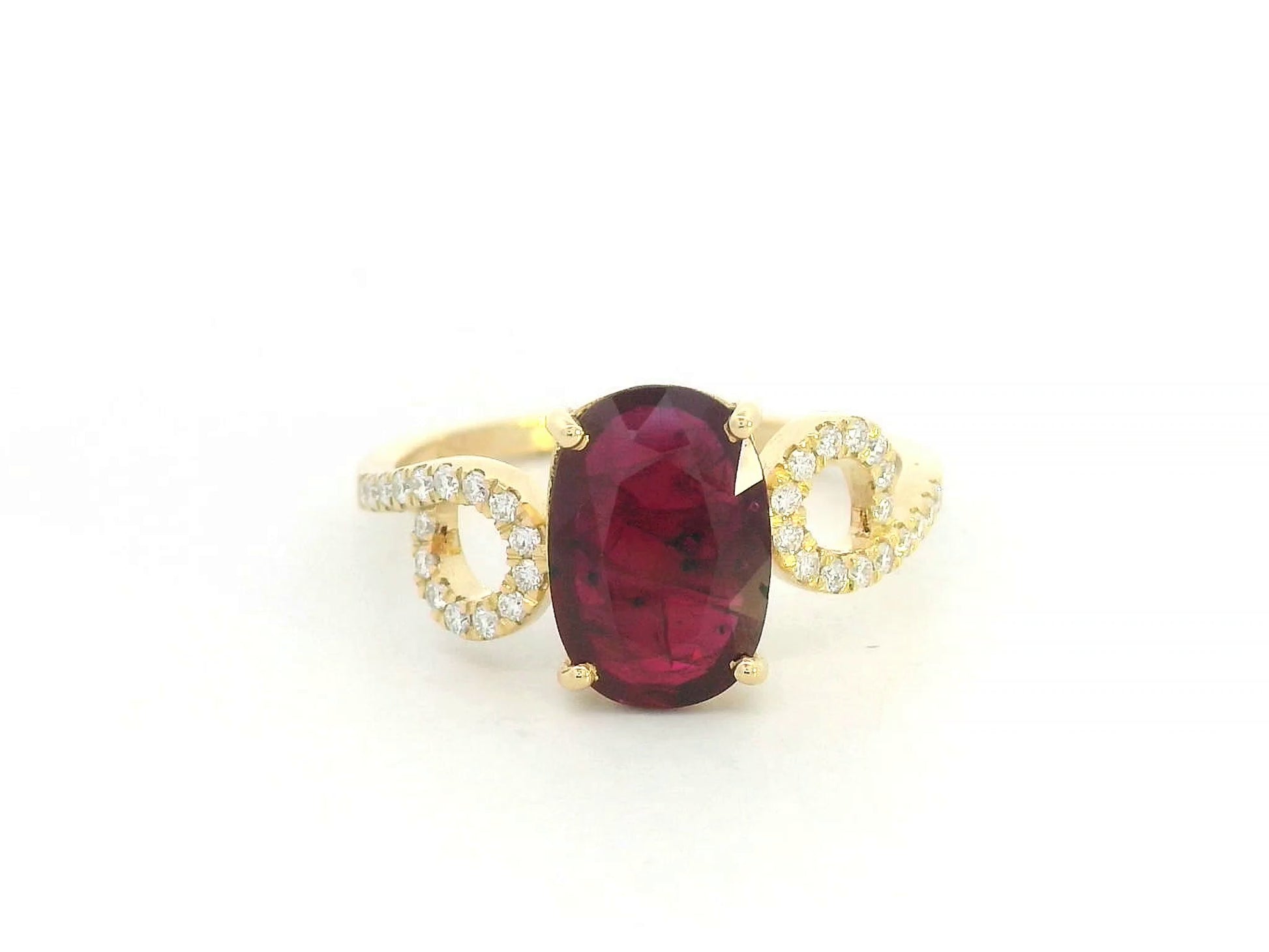 Front view of 18k yellow gold ring with 2.25 ct oval ruby and 0.18 ct diamond pavé shoulders