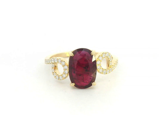 Front view of 18k yellow gold ring with 2.25 ct oval ruby and 0.18 ct diamond pavé shoulders