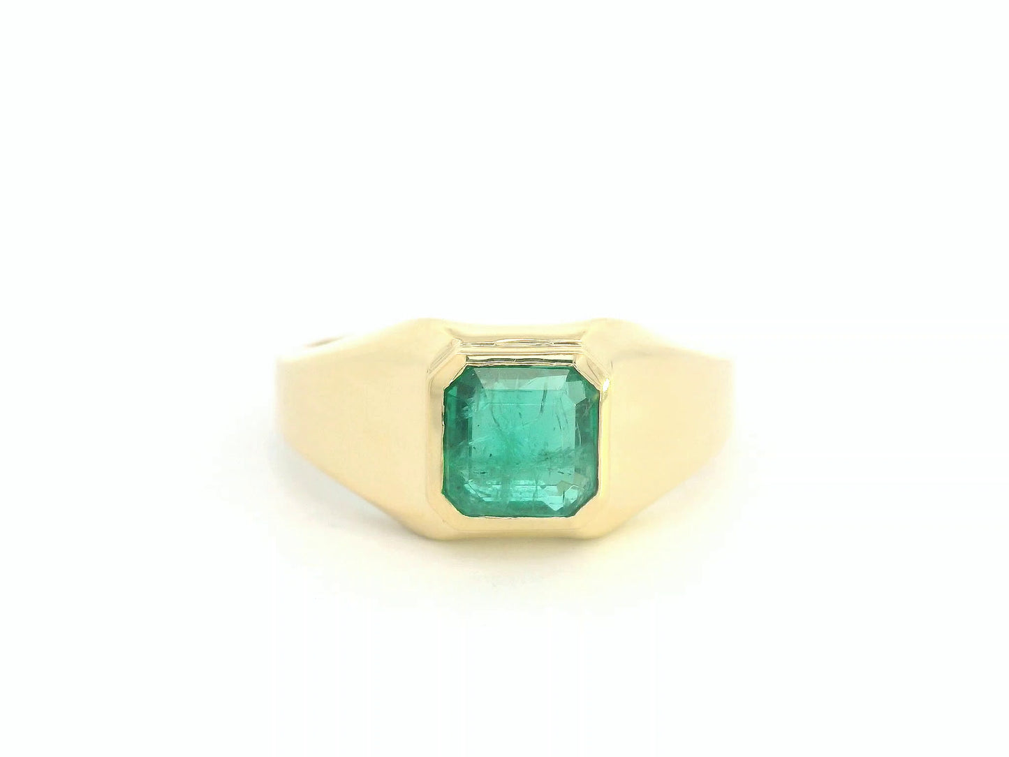Front view of 18k yellow gold signet ring with 1.82 ct emerald-cut emerald bezel set