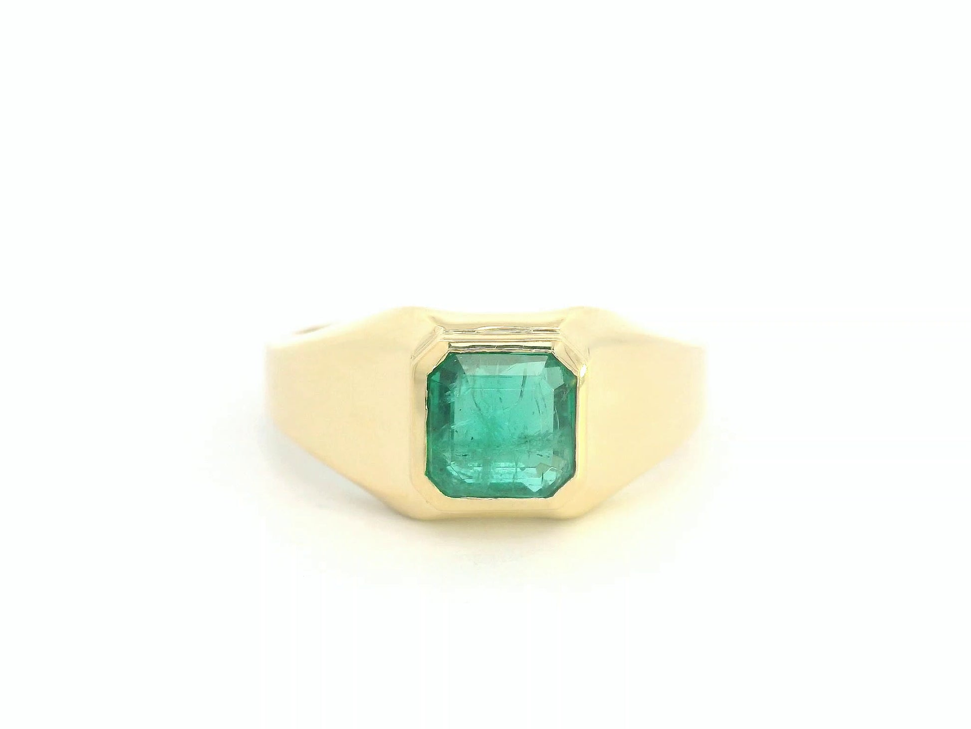 Front view of 18k yellow gold signet ring with 1.82 ct emerald-cut emerald bezel set
