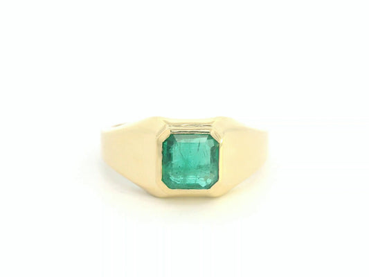 Front view of 18k yellow gold signet ring with 1.82 ct emerald-cut emerald bezel set
