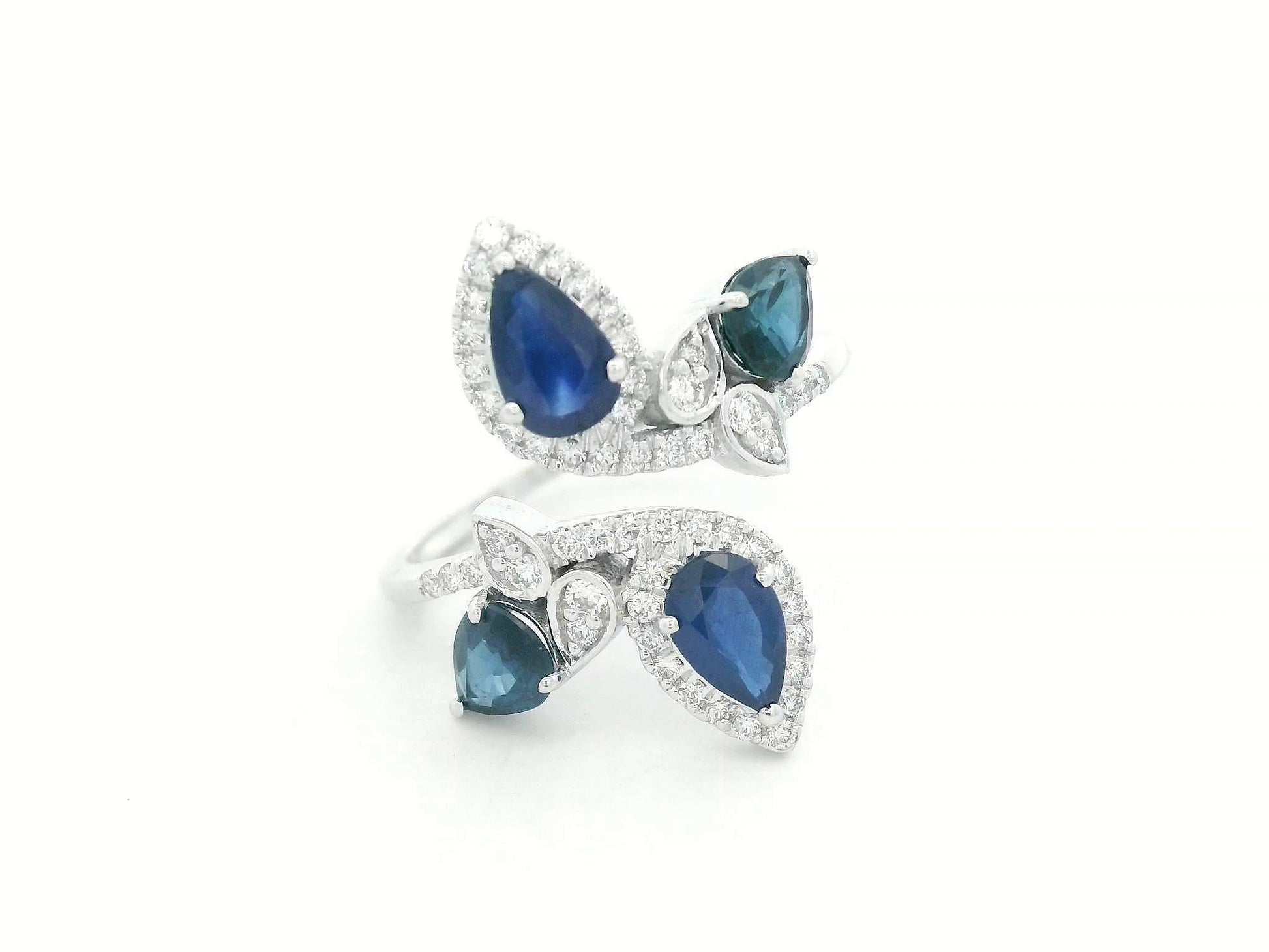 Front view of 18k white gold bypass ring with 1.55 ct blue sapphires and 0.27 ct diamonds