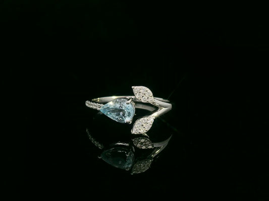18k white gold ring with 0.69ct pear aquamarine & 0.15ct diamond-accented leaves – certificate included