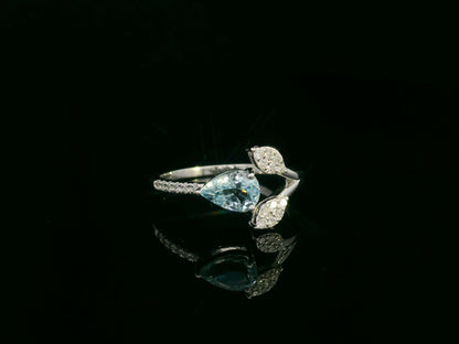 18k white gold ring with 0.69ct pear aquamarine & 0.15ct diamond-accented leaves – certificate included
