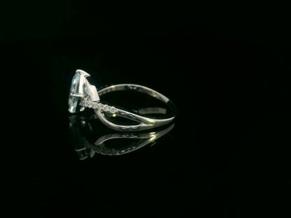 18k white gold ring with 1.24ct emerald-cut aquamarine & 0.12ct diamonds on straight and twisting split-shank – certificate included