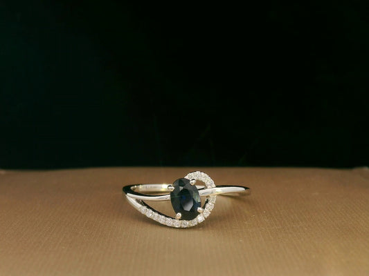 18k white gold ring with 0.63ct oval sapphire & 0.08ct diamond swirl – certificate included