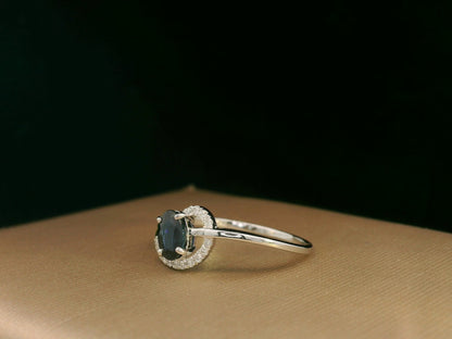 18k white gold ring with 0.63ct oval sapphire & 0.08ct diamond swirl – certificate included